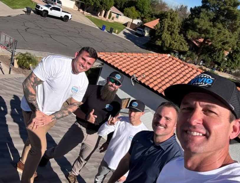 Clay tile roofs with mountain backdrop and palms